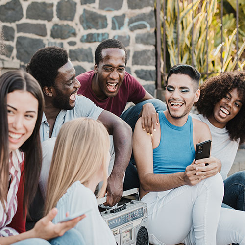 Young adults having fun, highlighting the independence and connection fostered through supported living services.